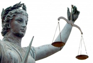 Scales representing justice and business case